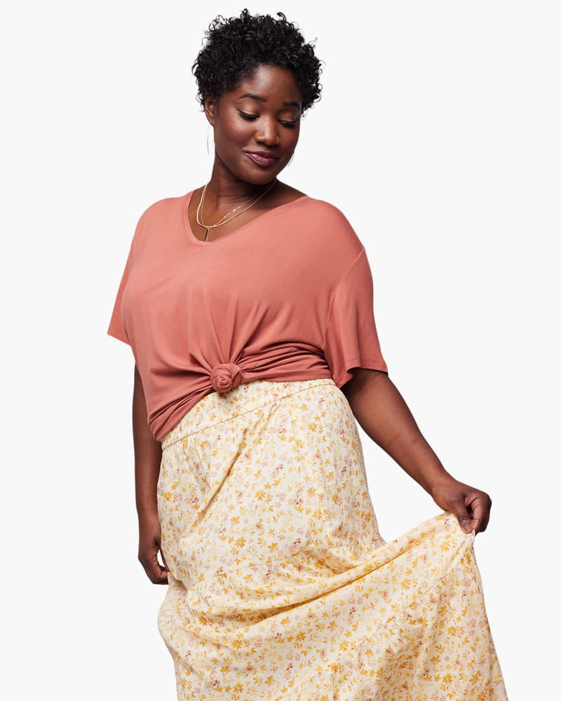 Front of a model wearing a size L Meghan Drapey V-Neck Tee in Rose by ABLE. | dia_product_style_image_id:271457